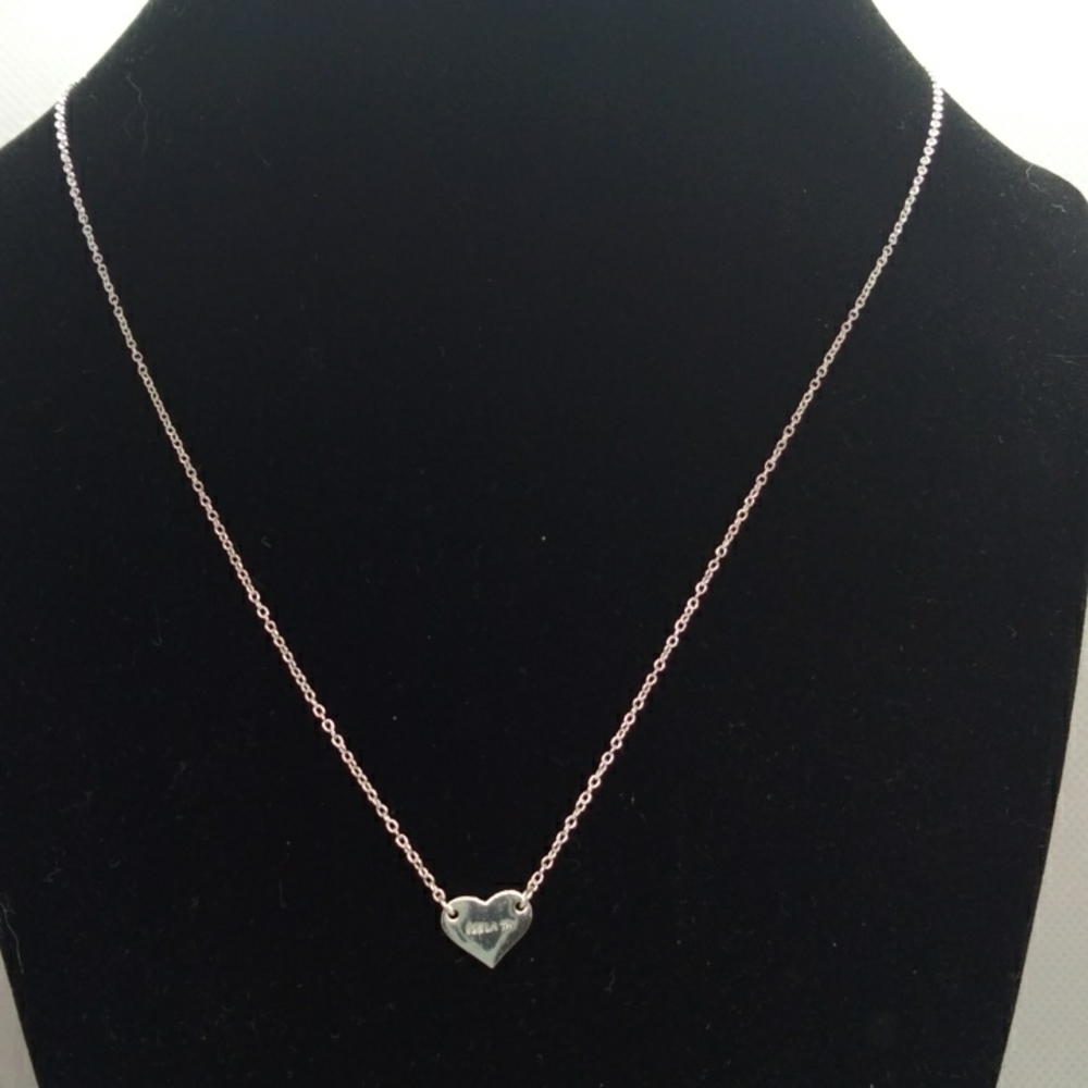 Sterling silver dainty necklace with heart pendant.